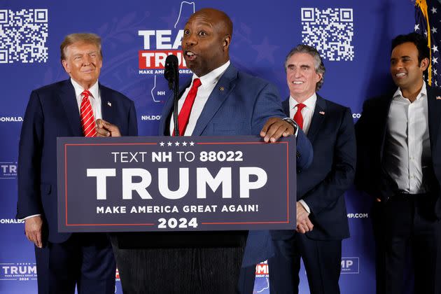 Sen. Tim Scott (R-S.C.) speaks as Trump (left), North Dakota Gov. Doug Burgum (second from right) and Vivek Ramaswamy (right) look on in Laconia, New Hampshire.