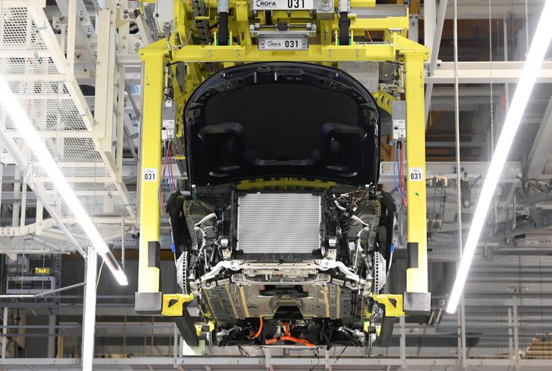 FILE PHOTO: A battery cell is installed at a Mercedes-Benz EQC electric car in a production line at a plant in Bremen