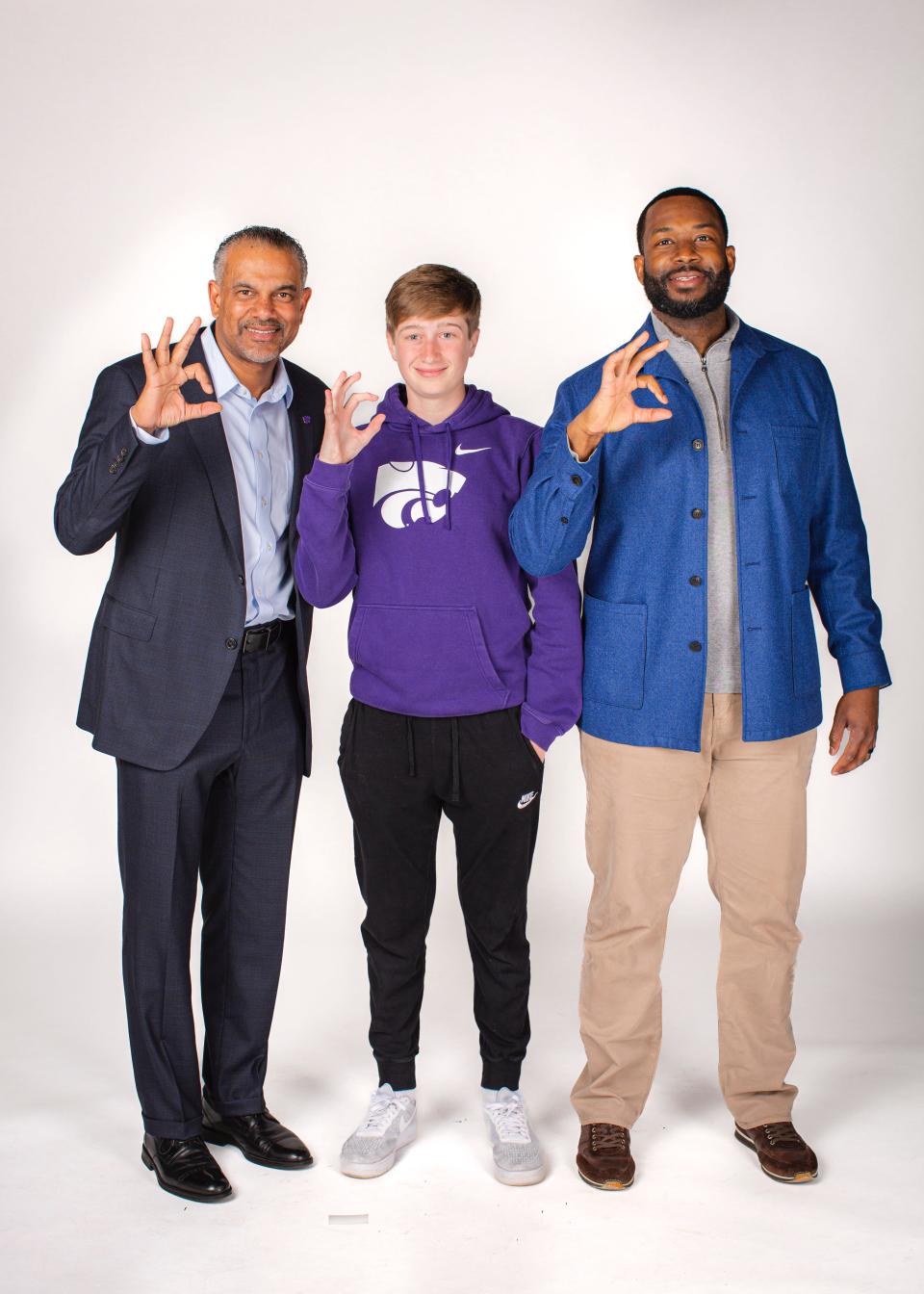 From left to right: Kansas State basketball coach Jerome Tang, Hayden High School student Dylan Foster and Kansas State associate head coach Ulric Maligi.