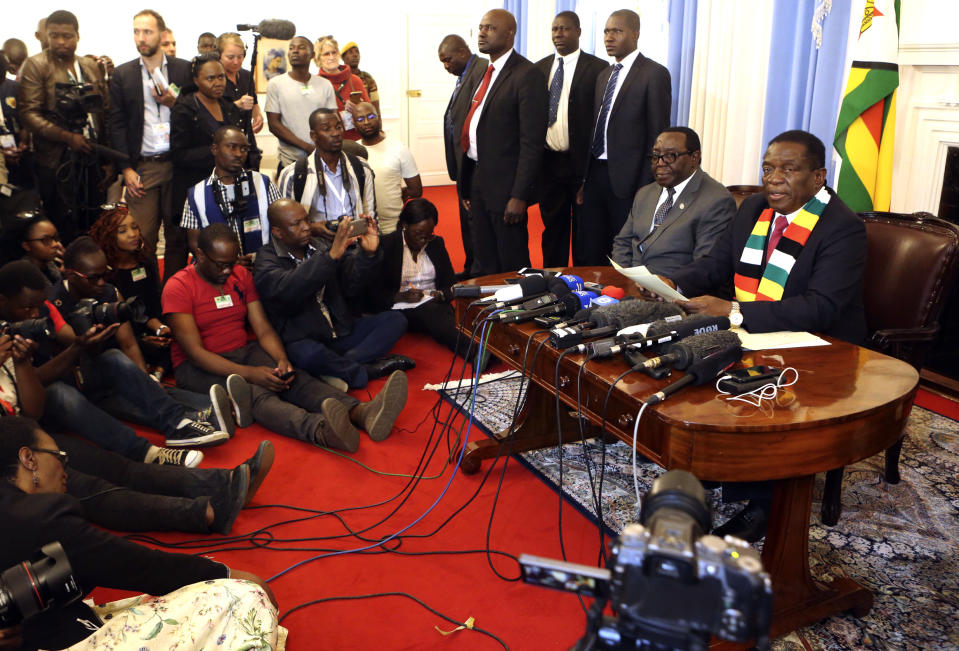 Zimbabwean President Emmerson Mnangagwa addresses a press conference in Harare ,Friday, Aug, 3, 2018. Zimbabwe's president says people are free to approach the courts if they have issues with the results of Monday's election, which he carried with just over 50 percent of the vote. President Emmerson Mnangagwa spoke to journalists shortly after opposition leader Nelson Chamisa called the election results manipulated and said they would be challenged in court. (AP Photo/Tsvangirayi Mukwazhi)