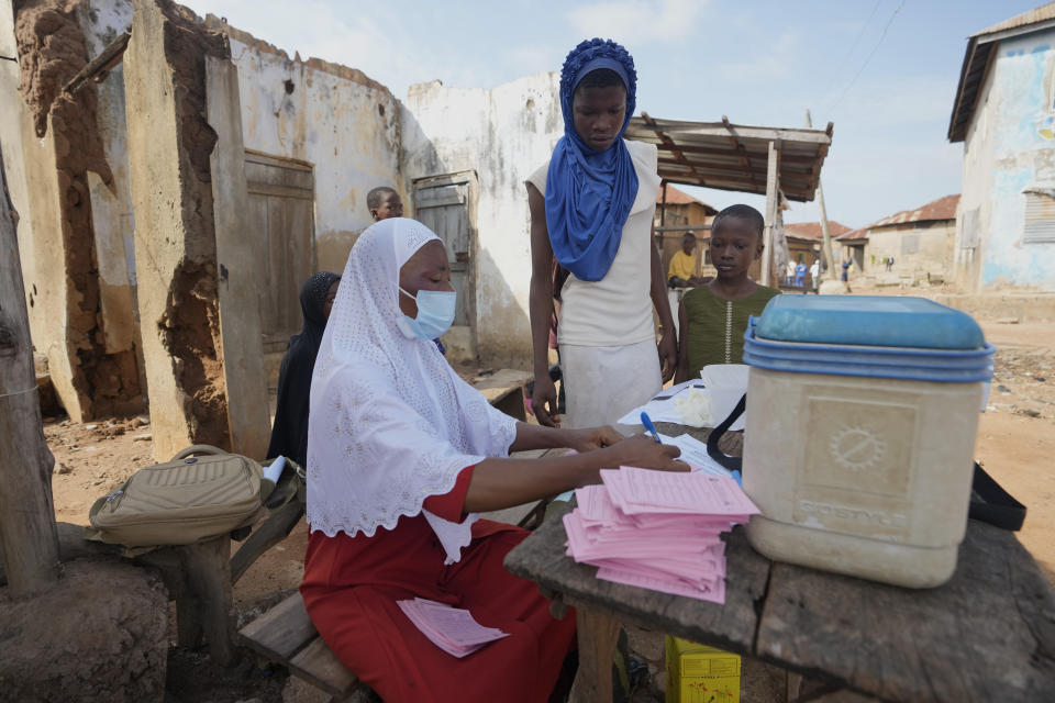 A health worker waits to administer a cervical cancer vaccine HPV Gardasil to young girls on the street in Ibadan,Nigeria, on May 27, 2024. African countries have some of the world's highest rates of cervical cancer. Growing efforts to vaccinate more young girls for the human papillomavirus are challenged by the kind of vaccine hesitancy seen for some other diseases. Misinformation can include mistaken rumors that girls won't be able to have children in the future. Some religious communities must be told that the vaccine is "not ungodly." More than half of Africa's 54 nations – 28 – have introduced the vaccine in their immunization programs, but only five have reached the 90% coverage that the continent hopes to achieve by 2030. (AP Photo/Sunday Alamba)