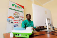 Abdurrahman Mohamed Abdullah, an employee of Somali Online Market (SOOMAR), works inside their office in the Hodan district of Mogadishu, Somalia, October 17, 2018 REUTERS/Feisal Omar