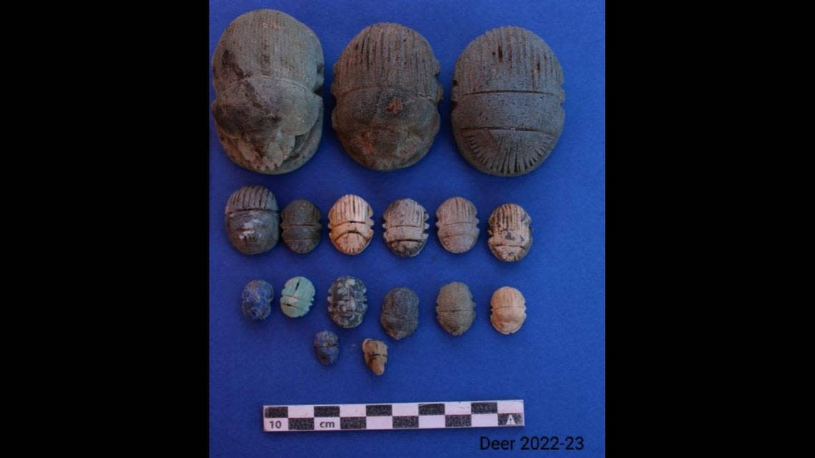 An assortment of scarab amulets of varying sizes found inside some of the graves