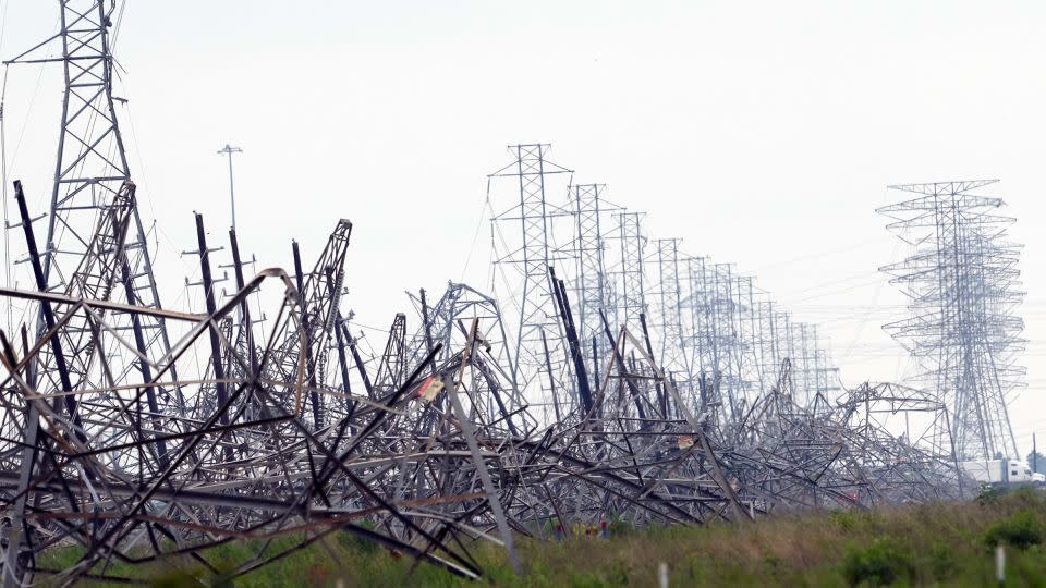 Down power lines are shown in the aftermath of a severe thunderstorm in Cypress, Texas, near Houston on Friday. - David J. Phillip/AP