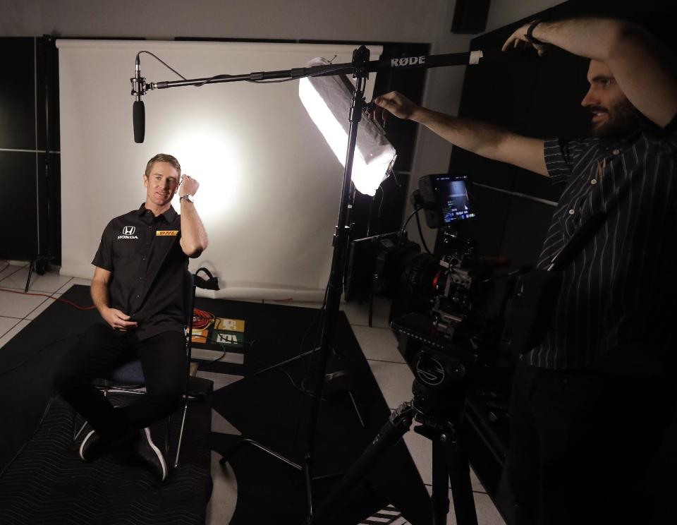 IndyCar veteran Ryan Hunter-Reay waits to be interviewed during IndyCar Series annual media day Wednesday, Jan. 18, 2017, in Indianapolis. (AP Photo/Darron Cummings)