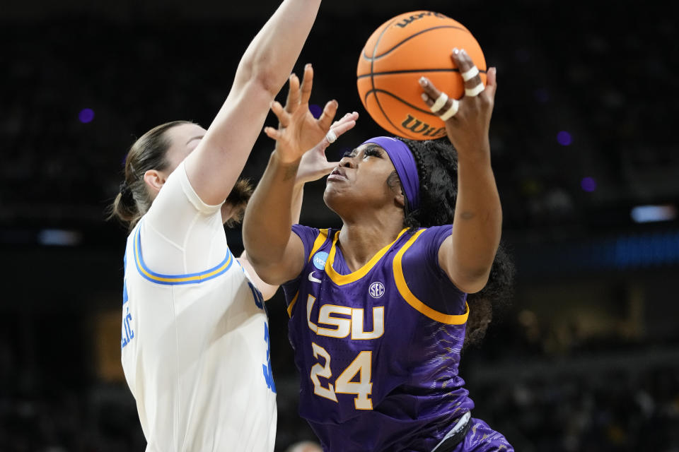 LSU guard Aneesah Morrow (24) goes up for a shot against UCLA forward Angela Dugalic (32) during the first quarter of a Sweet Sixteen round college basketball game during the NCAA Tournament, Saturday, March 30, 2024, in Albany, N.Y. (AP Photo/Mary Altaffer)