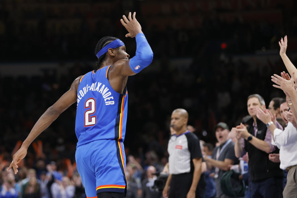 Oklahoma City Thunder guard Shai Gilgeous-Alexander (2) gestures to fans as he celebrates at the end of the team's NBA basketball game against the Sacramento Kings, Tuesday, April 9, 2024, in Oklahoma City. (AP Photo/Nate Billings)