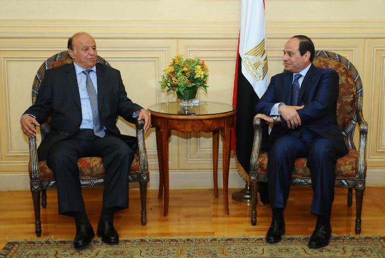 A picture made available on March 27, 2015 by the Egyptian presidency shows President Abdel Fattah al-Sisi (R) meeting with Yemen's President Abedrabbo Mansour Hadi in Red Sea resort of Sharm El-Sheikh