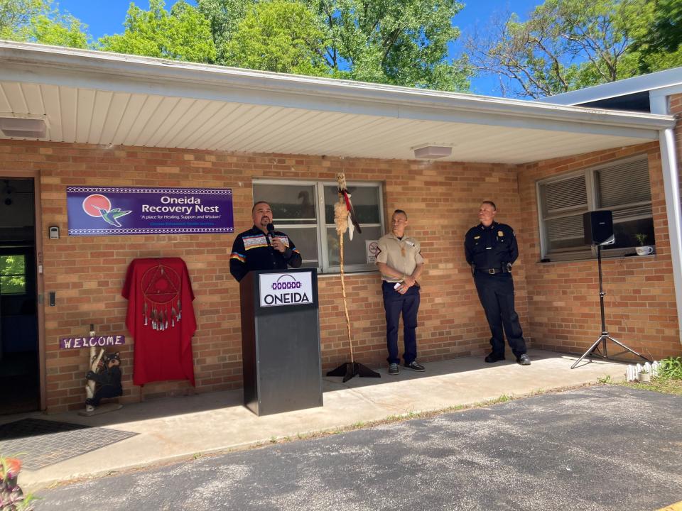 Tehassi Hill, center, talks about the impact fentanyl and opioid have had in the community. Mari Kriescher, director of Oneida Behavioral Health, stands left of Hill, and Patrick Danforth, recovery coach, and Joel Maxam, assistant chief of Oneida Police, stand at Hill's right.