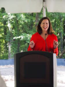  Errin Stanger speaks at the groundbreaking event on May 14, 2024, for Providence Park, a 50-acre homelessness village in Pulaski County. (Mary Hennigan/Arkansas Advocate)