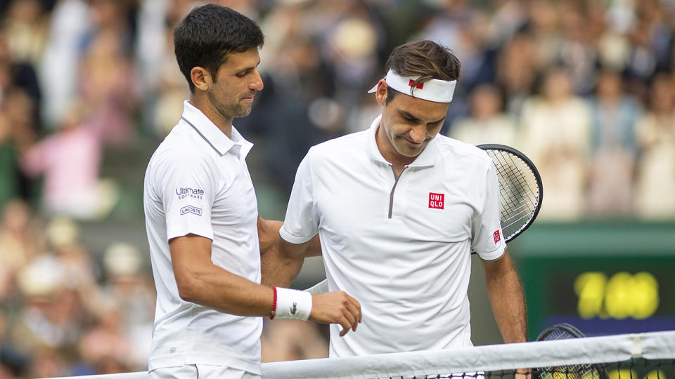 Novak Djokovic and Roger Federer are pictured at Wimbledon, 2019.