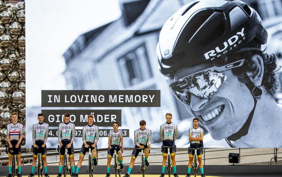 Cyclists of Bahrain Victorious team observe a minute of silence for their late teammate, Swiss rider Gino Mader