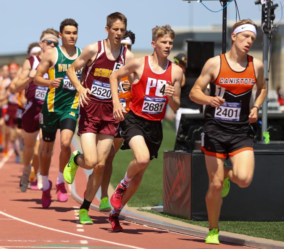 Nicholas Schlachter of Potter County (2681) and Lincoln Woodring of Northwestern (in green at left) are shown competing in the Class B boys' 3,200-meter run during the 2024 South Dakota High School Track and Field Championships at Howard Wood Field in Sioux Falls.