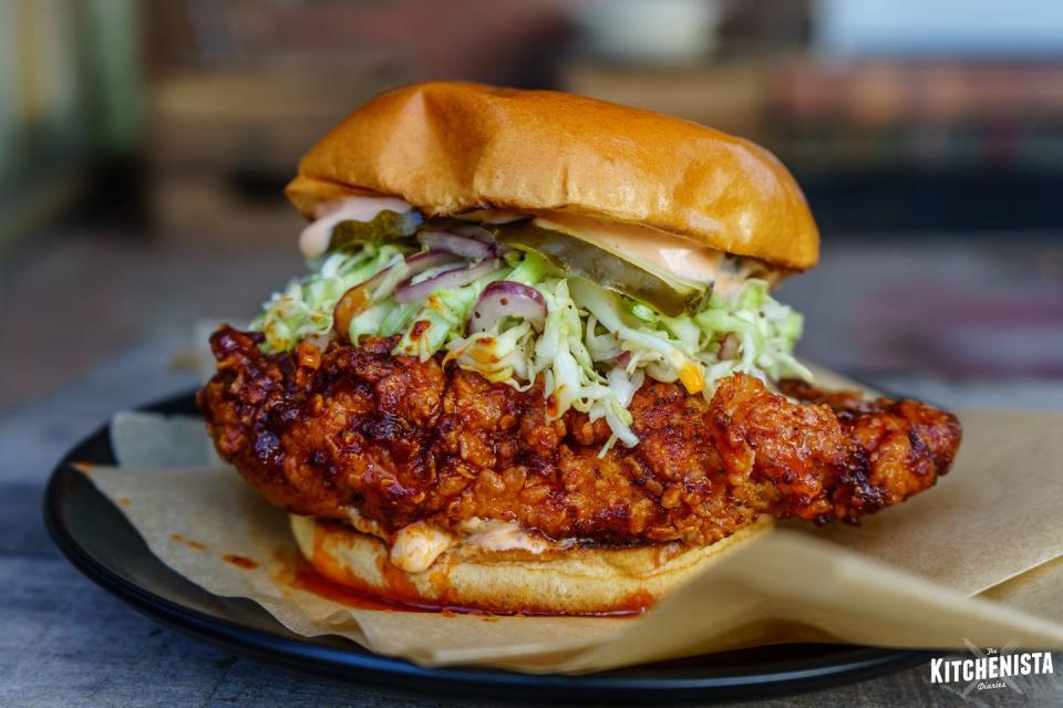 <p><strong>Hot Chicken Sandwich</strong></p><p>You haven’t had a true Hot Chicken Sandwich until you’ve been to Nashville -- specifically <a href="https://hattieb.com/" rel="nofollow noopener" target="_blank" data-ylk="slk:Hattie B’s;elm:context_link;itc:0;sec:content-canvas" class="link ">Hattie B’s</a>. This sandwich is for those who love spicy, topped with cayenne-pepper-spiced fried chicken. It comes in many variations from a po’ boy to a cubano. </p>