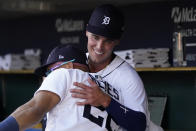 Detroit Tigers designated hitter Kerry Carpenter hugs Victor Reyes in the dugout before the first inning of a baseball game against the Cleveland Guardians, Wednesday, Aug. 10, 2022, in Detroit. Carpenter was making his major league debut. (AP Photo/Carlos Osorio)