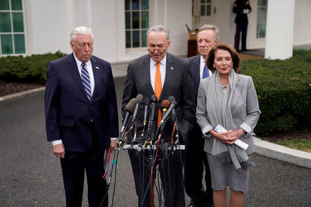 FILE PHOTO: U.S. Senate Minority Leader Chuck Schumer and Speaker of the House Nancy Pelosi speak to the news media along with House Majority Leader Steny Hoyer (L) and Senate Minority Whip Dick Durbin (R-Rear) as they depart the West Wing after meeting with President Donald Trump about the U.S. government partial shutdown and his demand for a border wall in the Situation Room at the White House in Washington, U.S., January 9, 2019. REUTERS/Joshua Roberts/File Photo