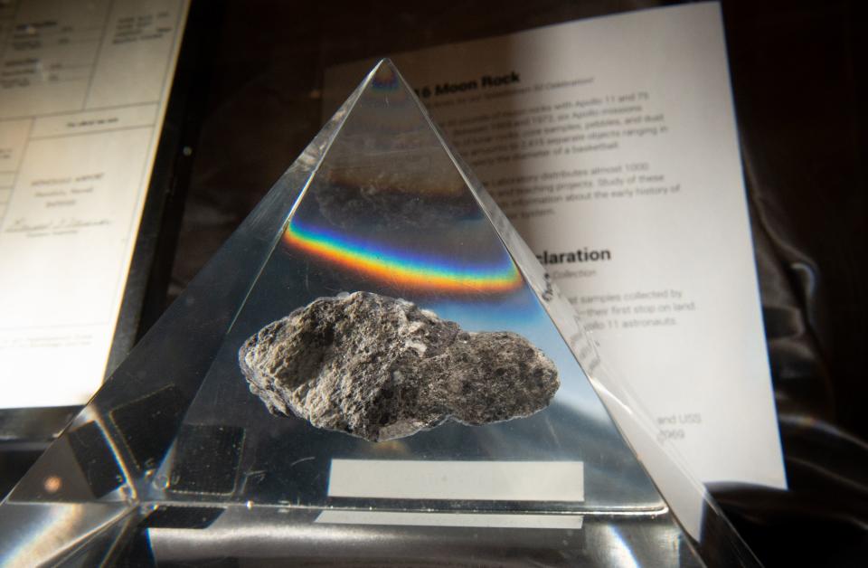 A rock from the moon is seen displayed inside a plexiglass case during a gala reuniting the Apollo team responsible for the historic lunar landing 50 years ago aboard the USS Hornet in Alameda, California on July 16, 2019. (Photo by JOSH EDELSON / AFP)        (Photo credit should read JOSH EDELSON/AFP/Getty Images)