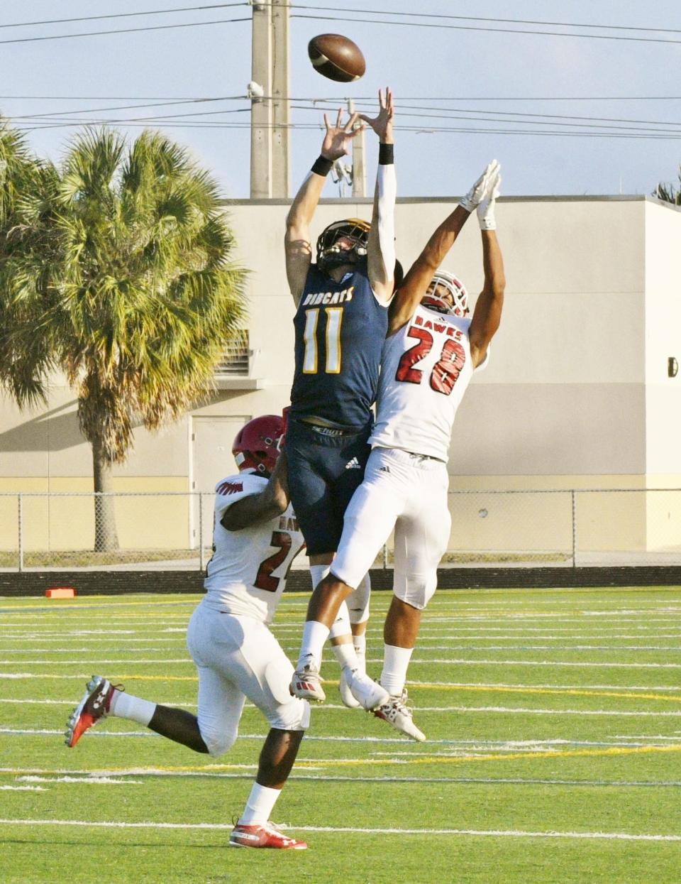 Boca Raton's Collin Bender goes up for a contested ball during last Friday's spring game against Seminole Ridge. He also caught a 67-yard touchdown pass in the contest.
