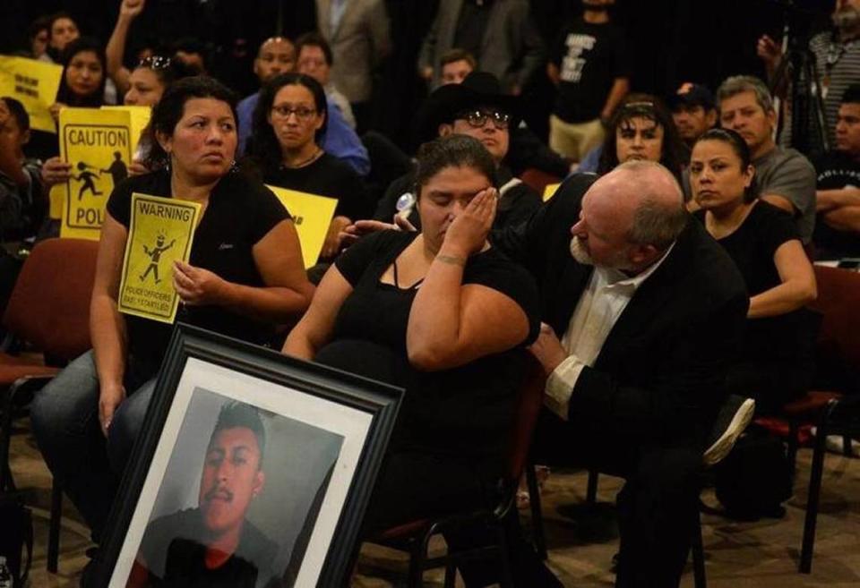 Ruben Galindo’s widow, Azucena Zamorano, cries and is comforted by Pastor Rusty Price at a discussion of Galindo’s shooting death between Charlotte-Mecklenburg police and the Latino community in October 2017. On Sept. 30, 2021, a federal judge dismissed her lawsuit against police and the city. Zamorano has filed an appeal.