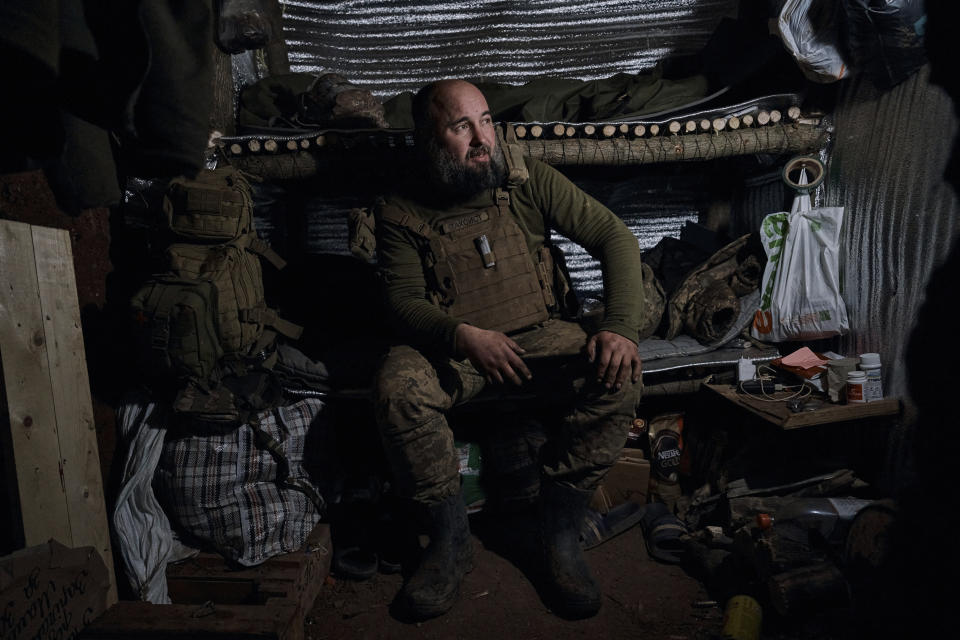 A Ukrainian soldier of the 28th brigade rests in a shelter at the frontline near Bakhmut, Donetsk region, Ukraine, Friday, March 24, 2023. (AP Photo/Libkos)