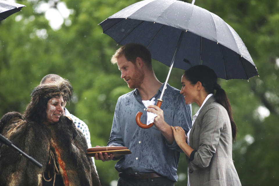 Britain's Prince Harry and Meghan, Duchess of Sussex attend a community picnic at Victoria Park in Dubbo, Australia, Wednesday, Oct. 17, 2018. Prince Harry and his wife Meghan are on day two of their 16-day tour of Australia and the South Pacific. (Ian Vogler/Pool via AP)