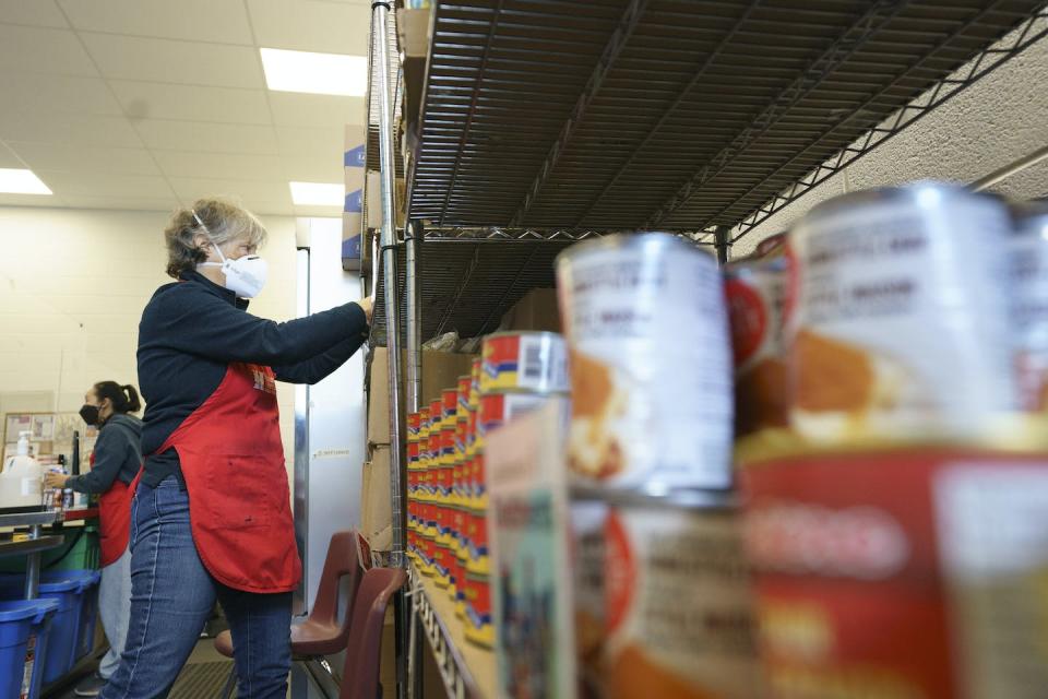 Volunteers work at the Bathurst/Finch Community Food Space in Toronto. Inflation is putting a greater strain on food banks. THE CANADIAN PRESS/Alex Lupul