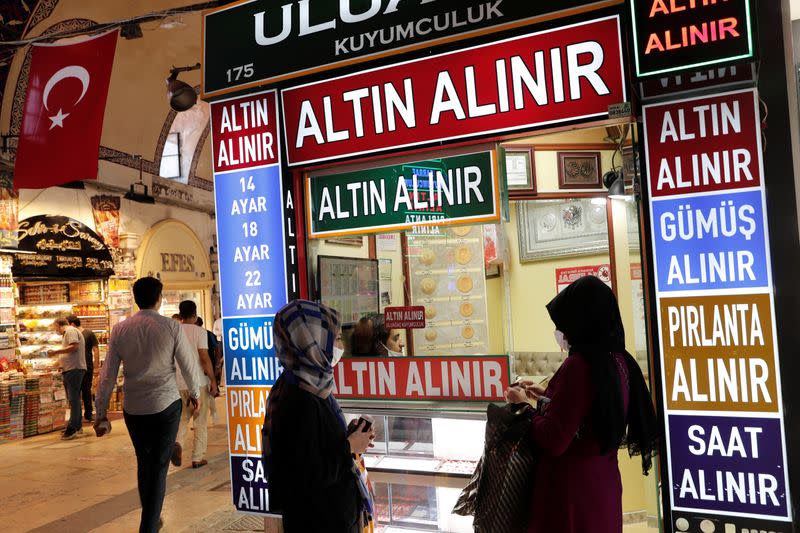 Women stand in front of a gold shop at the Grand Bazaar in Istanbul