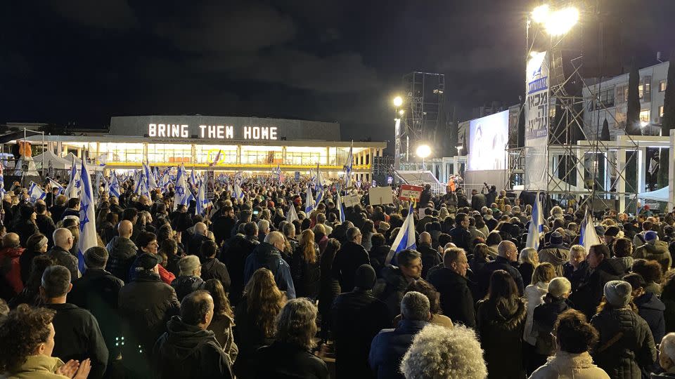 People gather for an anti-government protest outside Israel's national theater in Tel Aviv on Saturday, February 3, 2024. - Ivana Kottasova/CNN