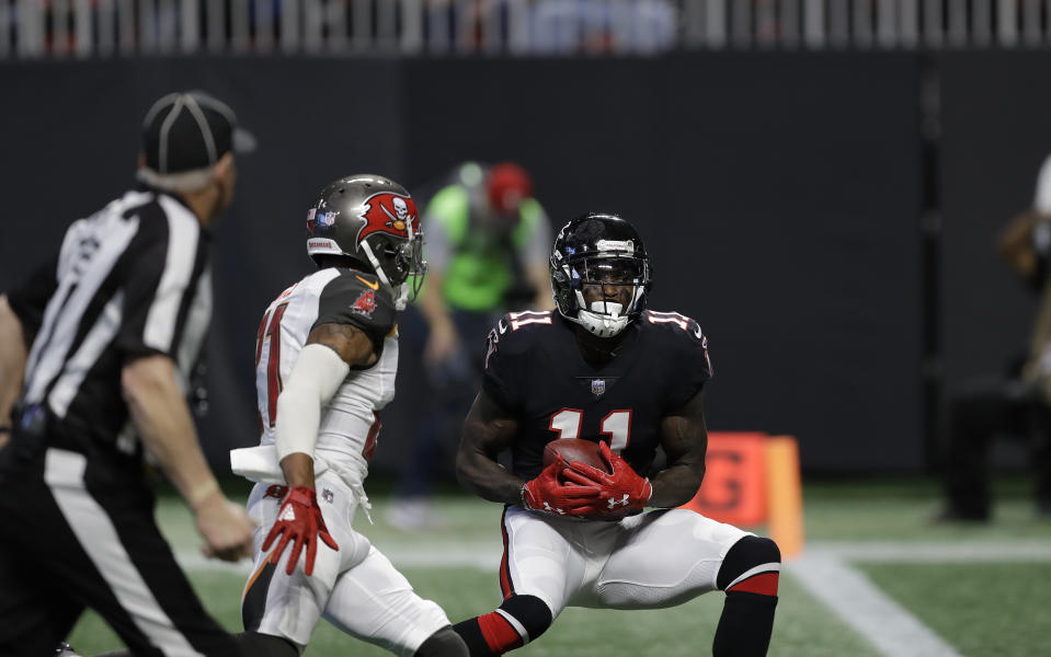 Atlanta Falcons wide receiver Julio Jones hauls in a touchdown pass from wide out Mohamed Sanu against the Tampa Bay Buccaneers. Yes, wide receiver Mohamed Sanu. (AP)