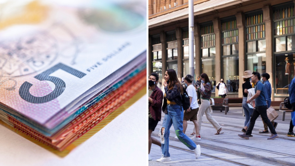 Stack of Australian currency, pedestrians cross road in Sydney. 