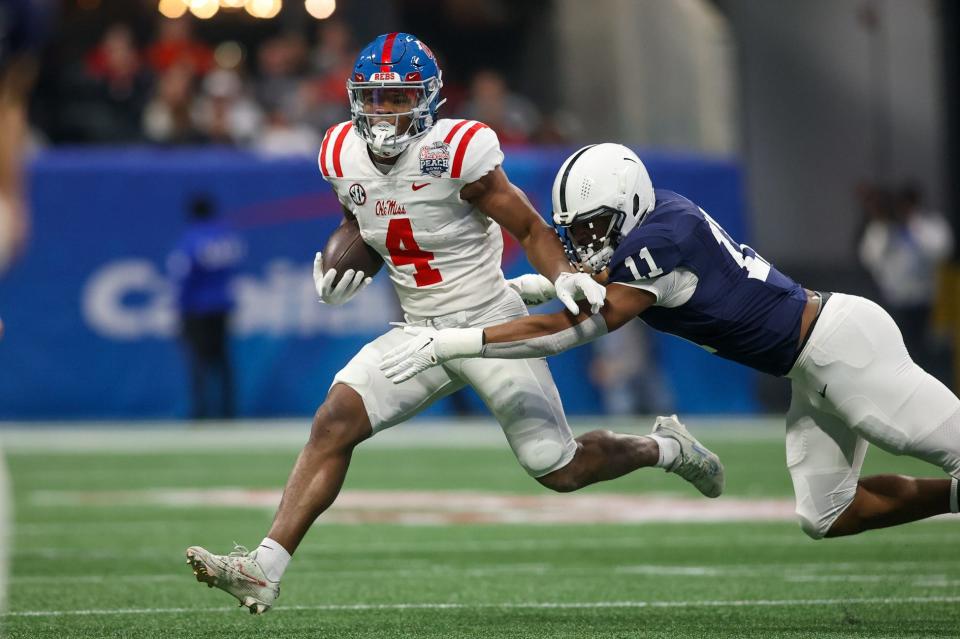 Dec 30, 2023; Atlanta, GA, USA; Mississippi Rebels running back Quinshon Judkins (4) is tackled by Penn State Nittany Lions linebacker Abdul Carter (11) in the first quarter at Mercedes-Benz Stadium. Mandatory Credit: Brett Davis-USA TODAY Sports