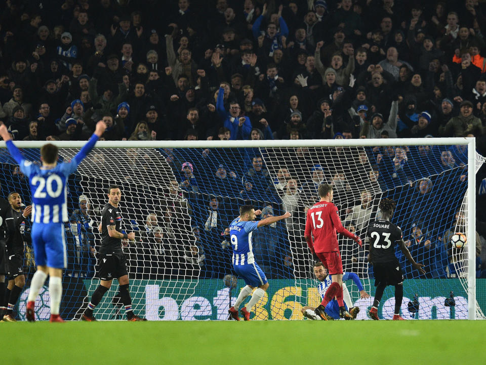 Glenn Murray bundles in the winner for Brighton: Getty