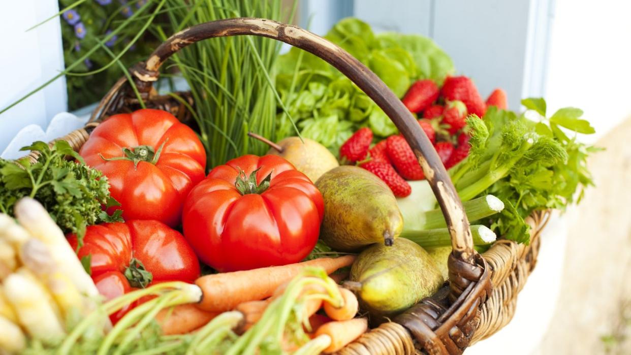 basket full of fresh fruit and vegetables