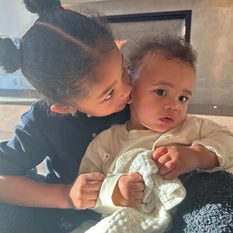 <p>Kylie Jenner Instagram</p> Kylie Jenner and Travis Scott's daughter Stormi kissing her brother Aire