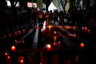 Students attend a silent candlelight vigil to protest against the assassination of investigative journalist Daphne Caruana Galizia in a car bomb attack two days ago, at the University of Malta in Msida, Malta, October 18, 2017. REUTERS/Darrin Zammit Lupi