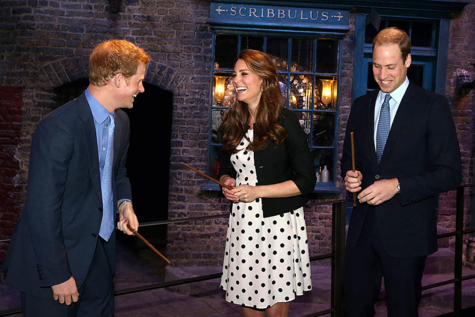 Kate, William and Harry have a giggle with wands at Warner Bros. Studios in 2013. (Getty Images)