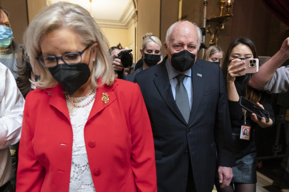 FILE - Former Vice President Dick Cheney walks with his daughter Rep. Liz Cheney, R-Wyo., vice chair of the House panel investigating the Jan. 6 U.S. Capitol insurrection, in the Capitol Rotunda at the Capitol in Washington, Jan. 6, 2022. (AP Photo/Manuel Balce Ceneta, File)