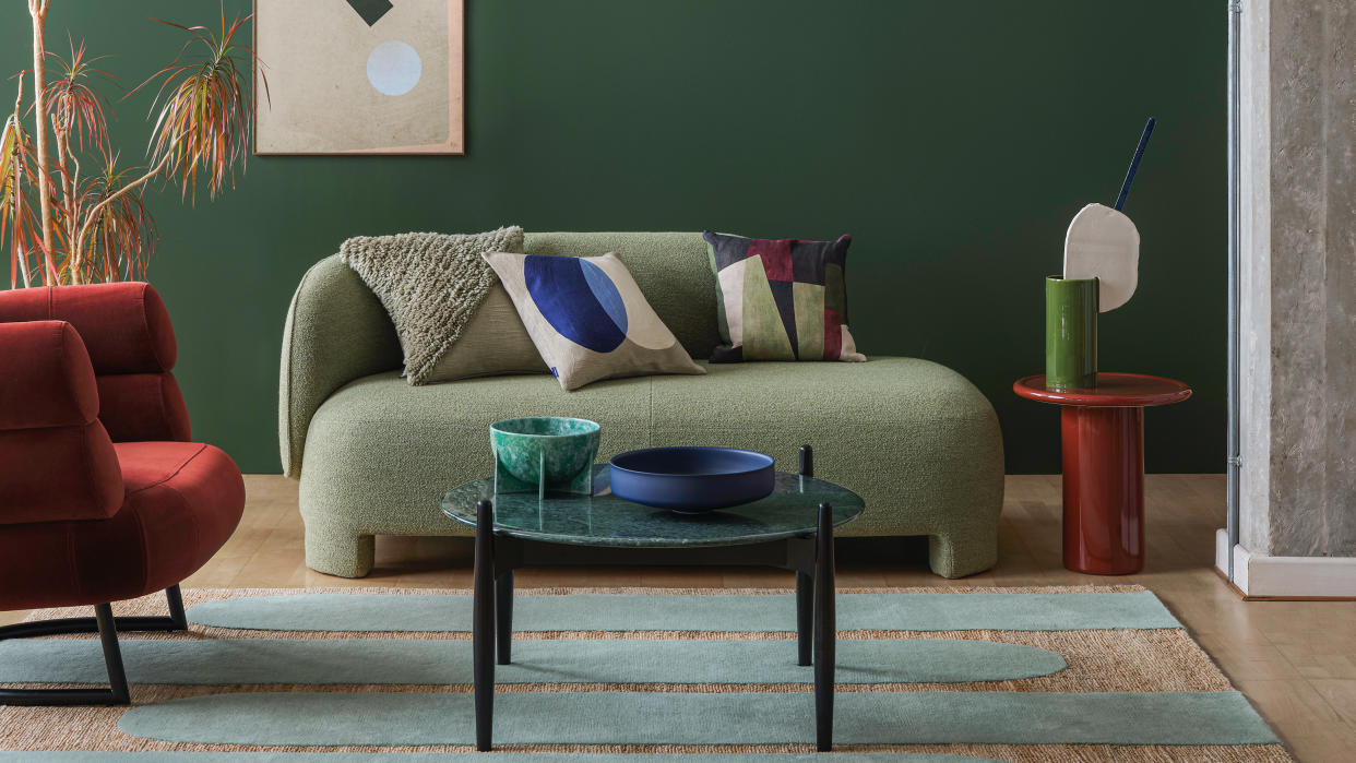  Green living  room with grey sofa. 