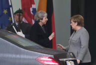 German Chancellor Angela Merkel, right, talks to British Prime Minister Theresa May after a meeting in the chancellery in Berlin, Germany, Tuesday, Dec. 11, 2018. May is visiting several European countries to seek "assurances" on the Brexit agreement with the European Union to aid its passage through Britain's parliament. (AP Photo/Michael Sohn)