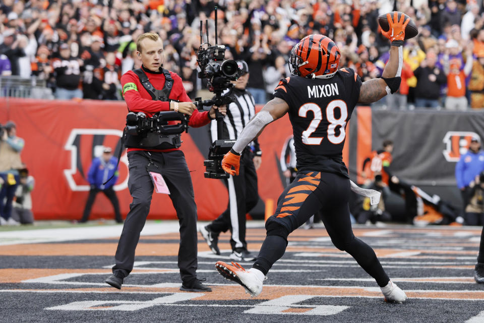 Cincinnati Bengals running back Joe Mixon (28) celebrates his rushing touchdown against the Minnesota Vikings during the second half of an NFL football game Saturday, Dec. 16, 2023, in Cincinnati. (AP Photo/Jay LaPrete)