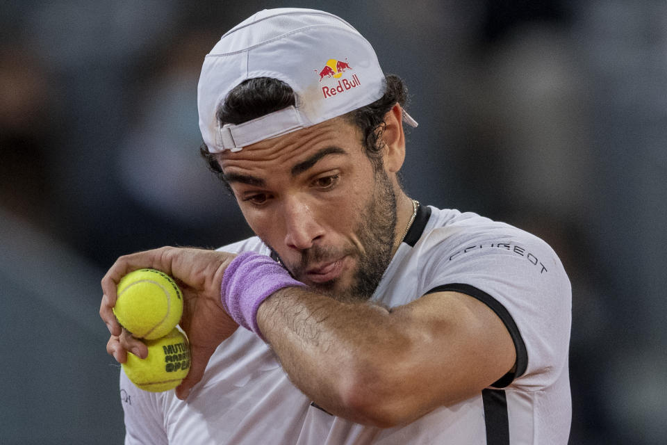 Italy's Matteo Berrettini prepares to serve to Germany's Alexander Zverev during the men's final match at the Mutua Madrid Open tennis tournament in Madrid, Spain, Sunday, May 9, 2021. (AP Photo/Bernat Armangue)