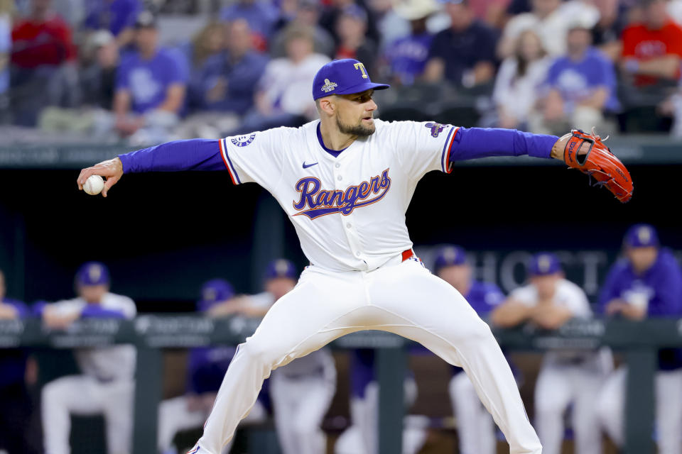 Texas Rangers starting pitcher Nathan Eovaldi winds up during the first inning of the team's baseball game against the Chicago Cubs, Thursday, March 28, 2024 in Arlington, Texas. (AP Photo/Gareth Patterson)