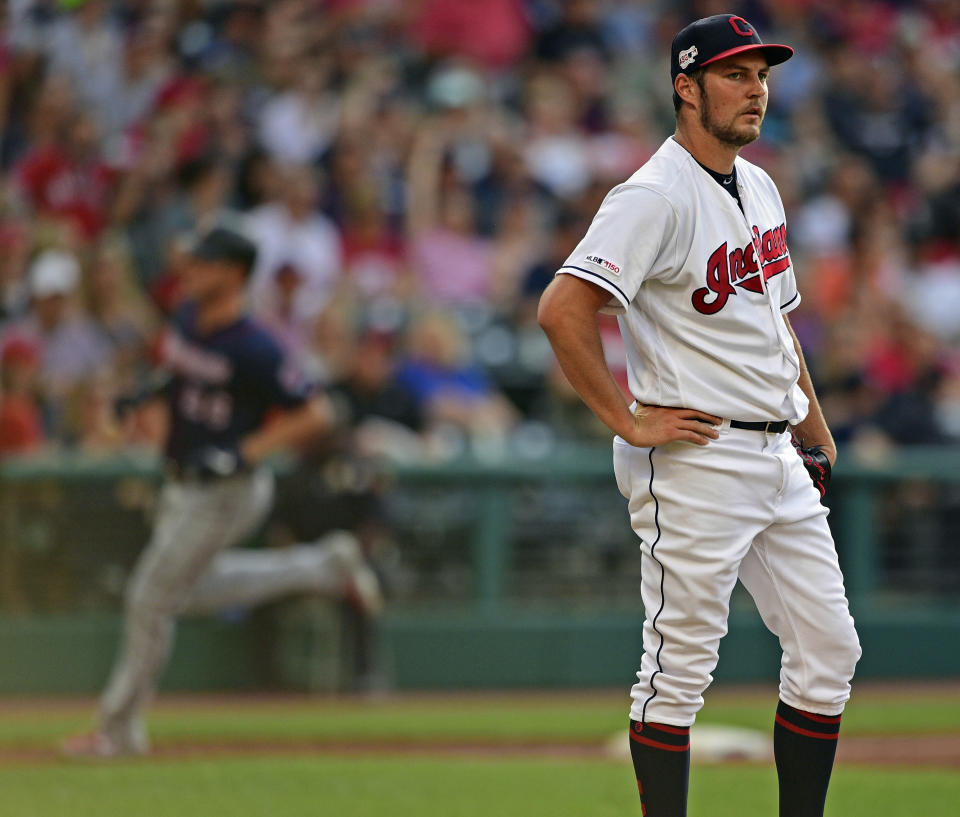 Cleveland Indians starting pitcher Trevor Bauer waits for Minnesota Twins' Max Kepler to run the bases after hitting a solo home run in the second inning of a baseball game , Saturday, July 13, 2019, in Cleveland. (AP Photo/David Dermer)