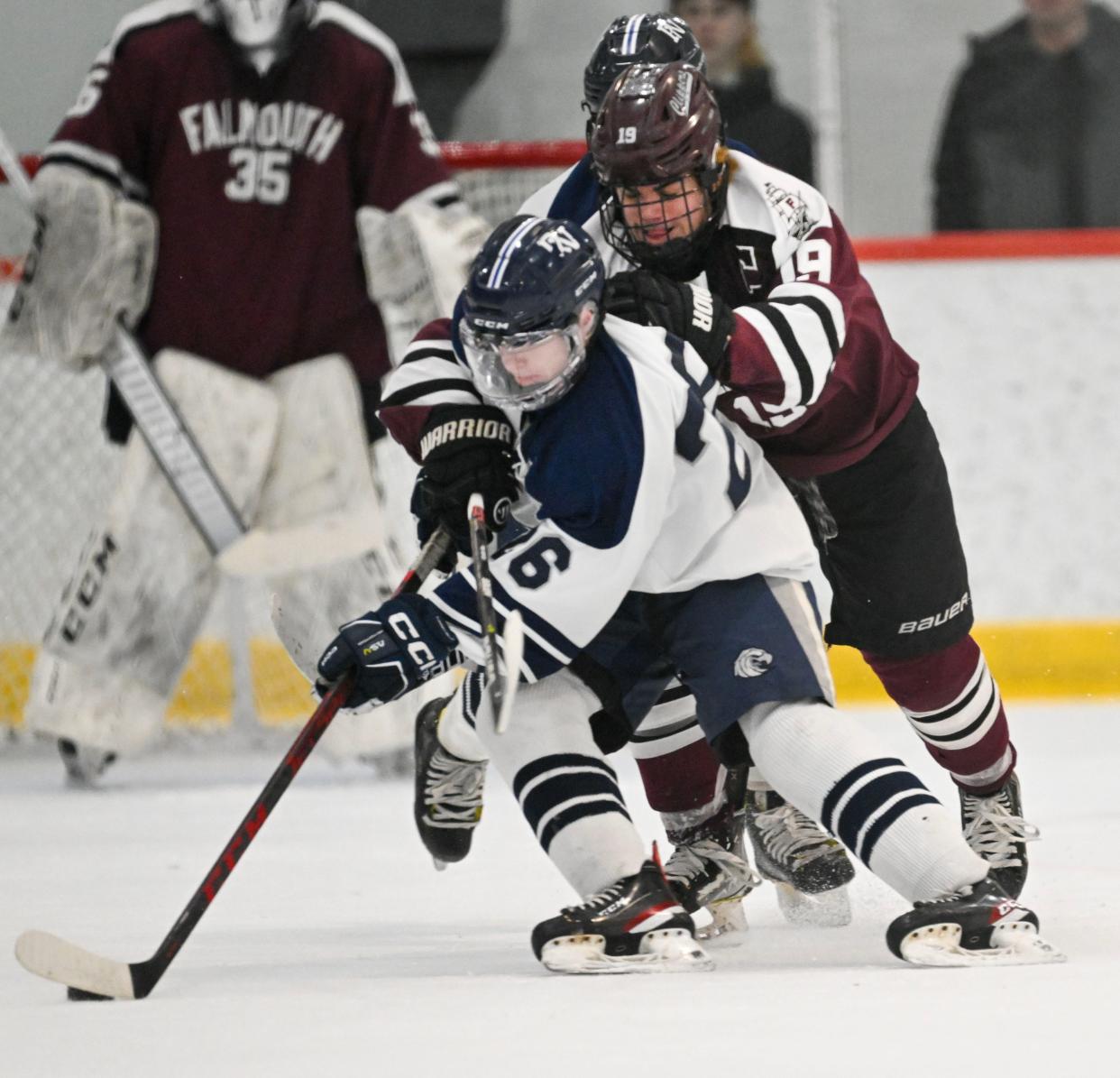 Charlie Bardelis of Falmouth pressures John Milne of Plymouth North. Falmouth lost 2-1 and ended its playoff run.