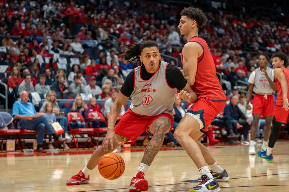 Oct 22, 2023; Dayton, OH, USA;
Ohio State Buckeyes forward Devin Royal (21) makes his way past the Dayton Flyers defender for a layup during their game on Sunday, Oct. 22, 2023 at University of Dayton Arena.