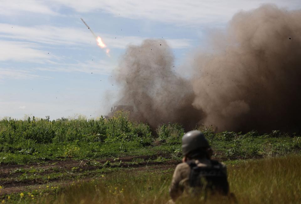 Ukrainian servicemen of the 10th Mountain Assault Brigade “Edelweiss” fire a rocket from a BM-21 ‘Grad’ multiple rocket launcher towards Russian positions, near Bakhmut in the Donetsk region on June 13 (AFP via Getty Images)