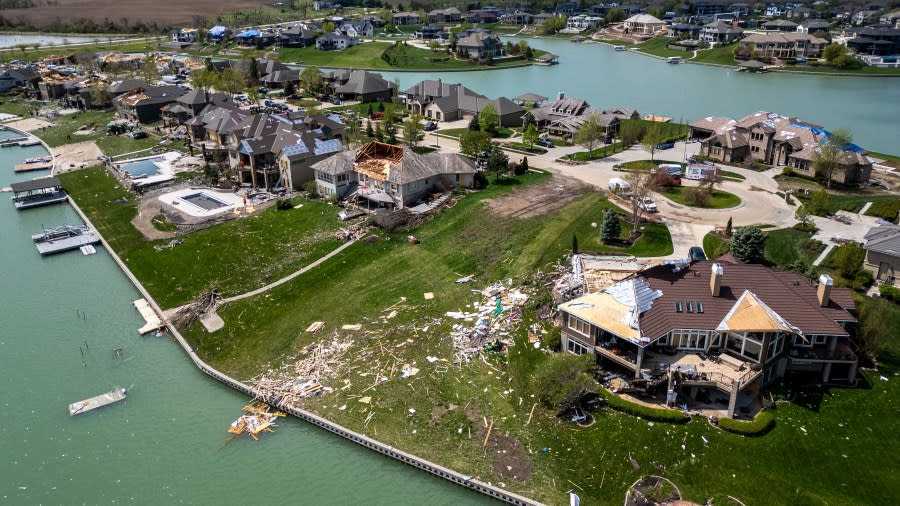Damaged homes are seen after a tornado hit the Newport Landing neighborhood in Bennington, Neb., Saturday, April 27, 2024. Dozens of reported tornadoes wreaked havoc Friday in the Midwest. (Chris Machian/Omaha World-Herald via AP)