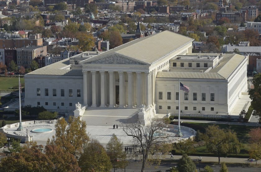 This Nov. 15, 2016 photo shows a view of the Supreme Court from the Capitol Dome, on Capitol Hill in Washington. An Asian-American rock band called the Slants has spent years locked in a legal battle with the government over its refusal to trademark the bandâ€™s name. The fight will play out Wednesday at the Supreme Court as the justices consider whether a law barring disparaging trademarks violates the band's free speech rights. (AP Photo/Susan Walsh)