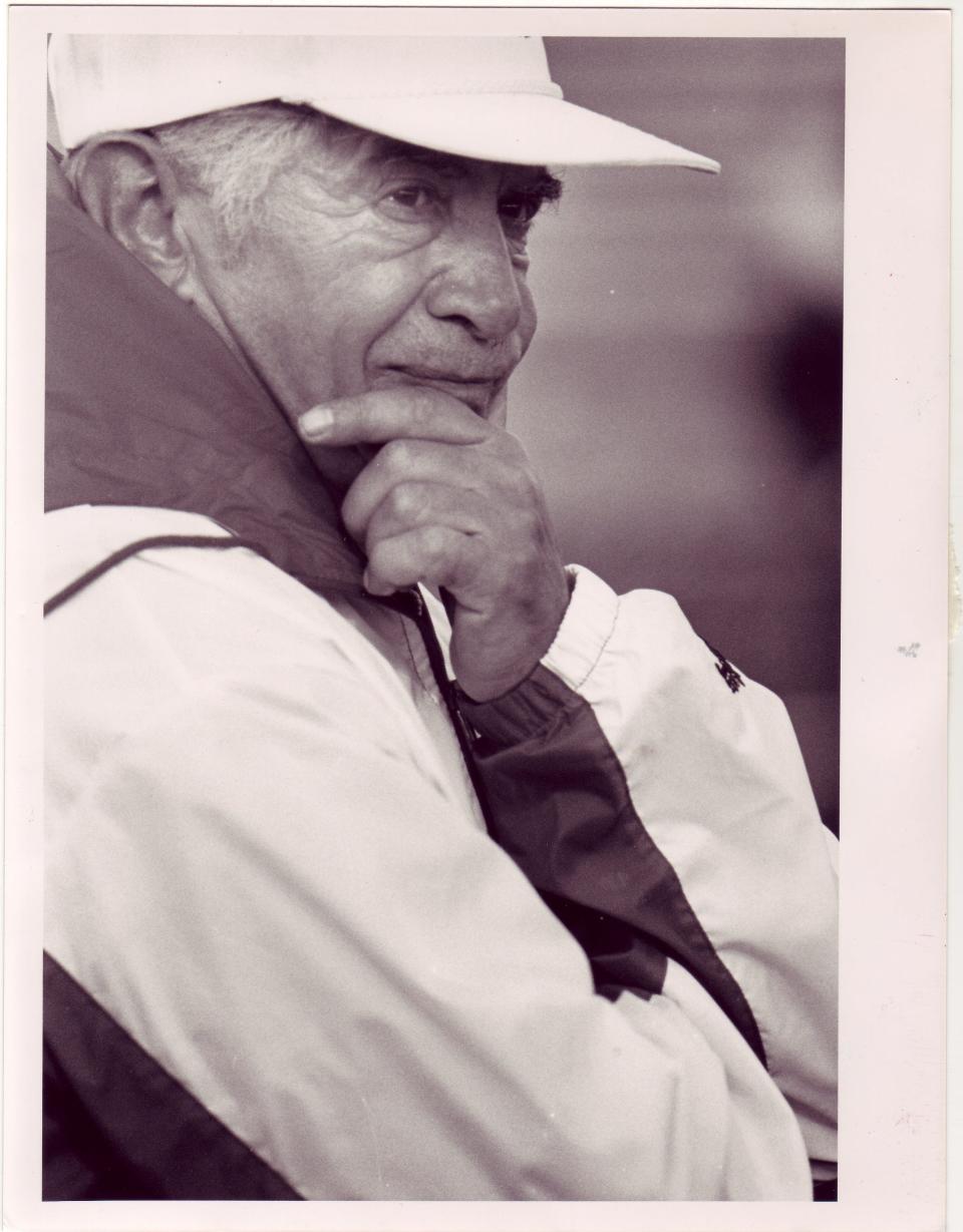 Sexton coach Paul Pozega quietly watches a relay against Everett in 1991. The hall of fame coach died Feb. 2 at the age of 93.