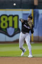 Miami Marlins shortstop Tim Anderson throws to first base during the fifth inning of a baseball game against the Oakland Athletics, Friday, May 3, 2024, in Oakland, Calif. Max Schuemann scored and Esteury Ruiz reached first on Anderson's throwing error. (AP Photo/Godofredo A. Vásquez)